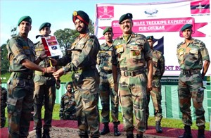 Commander Thanpir Brigade Brig PPS Bajwa handing over the flag to leader of the trekking expedition in Dharamshala.