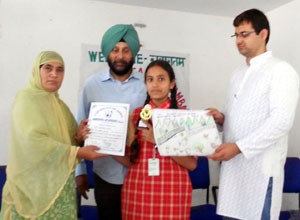 Winner of painting competition organized by Nirvana Academy being felicitated by the dignitaries at Ramban on Saturday.