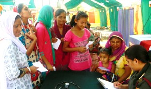 An Army doctor prescribing medicines to a patient during a medical camp at Chak Salariyan in Ramgarh sector of Samba district.