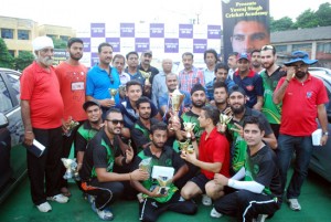 Jubilant RCC team players posing for a group photograph alongwith Romesh Mahajan, former chairman JKCA  and Ankush Abrol, Member BCCI in Jammu on Wednesday.