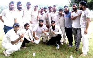  Jubilant JKCC team members posing for a group photograph after clinching victory over GNCC in Jammu on Wednesday.