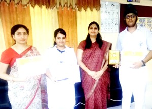 DPS students posing for a group photograph alongwith Principal and Teacher In-charge after claiming first prize in Debate competition.