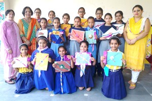 Winners of Rakhi making competition posing for a group photograph at Navyug Hr Secondary School in Jammu. 
