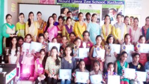 Winners Rakhi Making Competition posing for a group photograph alongwith dignitaries at Mount Litera Zee School in Kathua. 