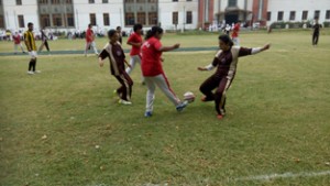 Women footballers in action during Football Tournament at Srinagar.