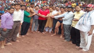 Wrestlers being felicitated by the chief guest at Reasi on Monday. 