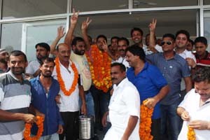 Arif Noor and other members of Market Association Gujjar Nagar after the election on Sunday.