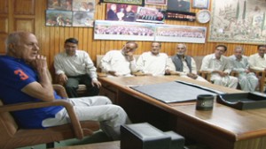 Former Chief Minister and NC president Dr Farooq Abdullah addressing party workers at Srinagar on Friday.
