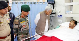 Chief Minister, Mufti Mohd Sayeed interacting with injured cop.