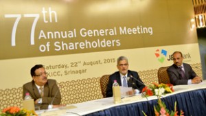 Commissioner/ Secretary Finance, Navin Choudhary (L) and Chairman/ CEO of JK Bank Mushtaq Ahmed (C) at 77th AGM of the Bank in Srinagar on Saturday.