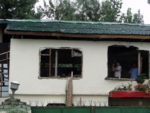 A structure inside Dal lake being demolished.