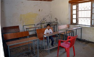 A lone student waiting for teacher in a Baramulla school.  -Excelsior/ Aabid Nabi