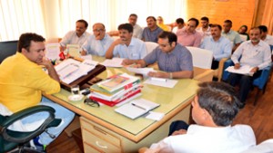 Minister for CA&PD, Choudhary Zulfkar Ali chairing a meeting at Srinagar on Thursday.