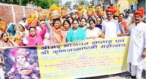 MoS Education Priya Sethi and other devotees participating in Kalash Yatra taken out in Jammu on Sunday. - Excelsior/Rakesh