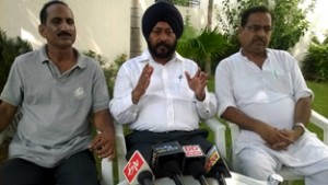 Former Minister and JKPCC general secretary Manjit Singh, alongwith other party leaders addressing media persons at Vijaypur in Samba.