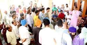 Speaker Legislative Assembly Kavinder Gupta interacting with people in Gandhi Nagar constituency on Sunday.
