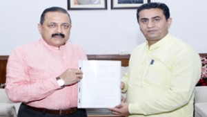 Union Minister Dr Jitendra Singh receiving a Detailed Project Report (DPR) for the proposed "Dreamland Park" at Kathua from MLA Kathua, Rajiv Jasrotia, at New Delhi on Wednesday.