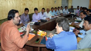 Minister for Animal and Sheep Husbandry Sajjad Gani Lone chairing a meeting at Srinagar on Thursday.