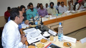 Minister for CAPD, Ch Zulfkar Ali reviewing progress of development works in a meeting at Rajouri on Friday. 