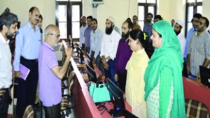 Minister for Education, Naeem Akhtar interacting with Government teachers during a training programme at Srinagar on Friday.