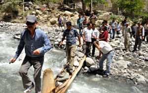CEC Rigzin Spalbar during visit to a flood affected village in Leh.