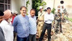 Speaker, Kavinder Gupta taking stock of damages caused by floods in Nanak Nagar on Monday.