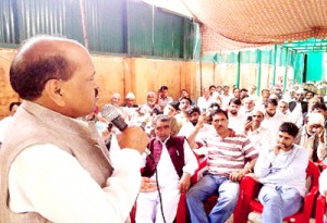 Former Minister AG Vakil addressing workers’ convention in Srinagar on Monday.