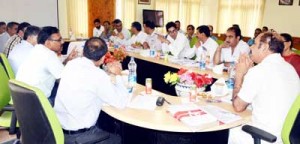 Minister for Law, Sayeed Basharat Bukhari chairing a meeting at Srinagar on Monday.
