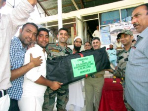 Cricket gear being presented to winners of cricket tournament for deaf  in Baramulla.