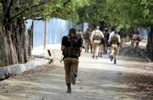 Troops in action during encounter in Vilgam area                              of Handwara in Kupwara district on Thursday.  -Excelsior/Aabid Nabi