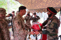 Indo-Pak Army officials meet at Chakan-Da-Bagh in Poonch on Monday.