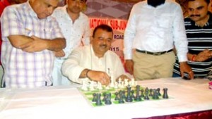 Minister for Industries Chander Prakash Ganga displaying chess skills while inaugurating 41st  National Sub Junior Chess Championship in Jammu on Monday.