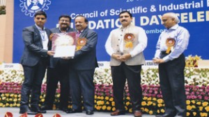 Dr Bhahwal Ali Shah receiving CSIR Young Scientist Award from dignitaries. 