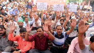 PHE ITI trained and CP workers holding protest in Jammu on Wednesday.
