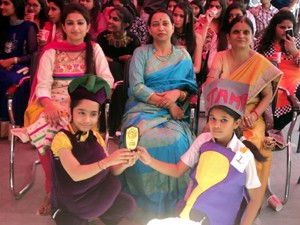 Winners of Fancy Dress Competition posing for a group photograph alongwith staff members at JK Montessorie School.