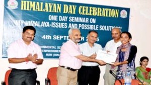 JU VC Prof R D Sharma presenting certificate to one of the participants of seminar on Friday.