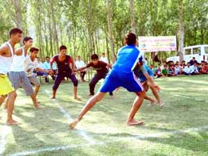 Kabaddi players in action during Rural Sports Competitions under RGKA at Arnas in Reasi.  