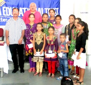 Students posing alongwith dignitaries during scholarship camp launched by HBET in a Jammu.