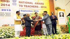 KV Kathua teacher receiving award.