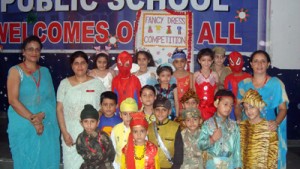 Toddlers of RM Public School posing for group photograph with Trustee and Principal during a fancy dress competition on Saturday.