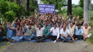Casual labours of Agriculture Department during a protest dharna at Krishi Bhawan Talab Tillo, Jammu.