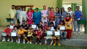 Footballers of KCIS posing alongwith School staff on Wednesday.