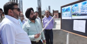 Minister for Public Works, Syed Mohammad Altaf Bukhari  being briefed about a project on Thursday.