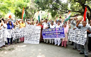 PoJK refugees during a protest near Press Club, Jammu on Monday. -Excelsior/ Rakesh