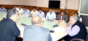 Chief Secretary, B R Sharma chairing a meeting at Srinagar on Friday.