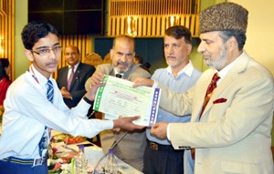 MP, Muzaffar Hussain Baig giving away certificate to a student at Srinagar on Sunday. 