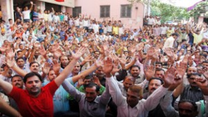 PHE workers holding protest demonstration outside Chief Engineer's office on BC Road in Jammu on Monday. -Excelsior/ Rakesh