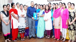 Union Minister Dr Jitendra Singh receiving a memorandum from a deputation of Grih Kalyan Kendra (GKK) workers at his DoPT office in North Block, New Delhi .