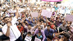 PHE workers staging protest demonstration outside Chief Engineer’s office on BC Road in Jammu on Monday.           -Excelsior/ Rakesh 