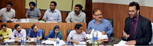 Minister for Revenue, Javaid Mustafa Mir reviewing progress on 4-laning of NH in a meeting at Jammu on Monday.